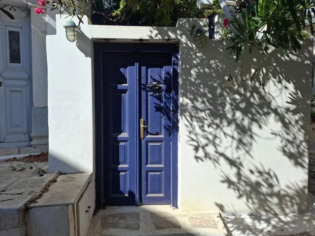 Photo of a door situated in one of the villages in Astypalea, Greece.